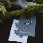 The Herbarium zine with a linocut plant card